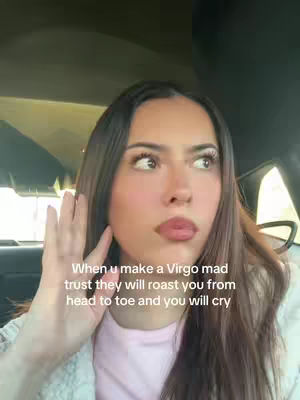 A woman looking into the distance as though being spoken to, her right hand is raised towards her head. There is text overlaid.
