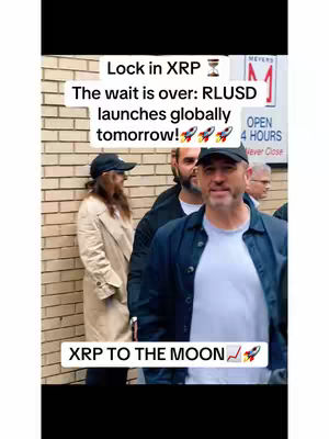 The cover image shows a group of people standing outside a building. In the foreground, a man in a black cap is smiling at the camera, while other people are visible in the background. Text overlays on the image provide information about RLUSD and XRP.