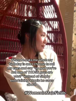 A woman with dark hair in a bun is seated in a hanging chair in front of a window. Text overlay is used for the hook elements.