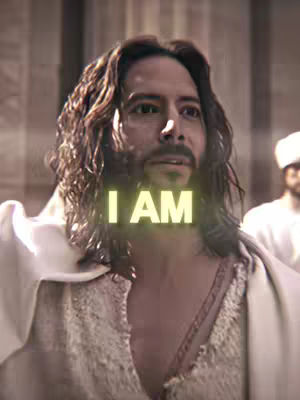 The cover image shows a still from what appears to be a film scene centered on a man with long hair and a beard, and wearing a white robe. The text overlayed is "I AM" in large, illuminated font.