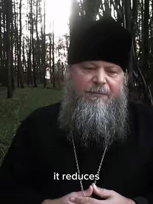 The cover image features a man in a black robe and hat with a long, gray beard, positioned in front of a blurred background of trees. The text overlayed on the image reads ", it reduces". The composition is a medium shot, focusing on his face and upper body.