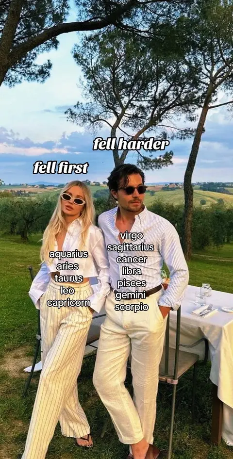 A couple stands outdoors with a scenic backdrop. The woman on the left is wearing sunglasses and white clothing. The man on the right also wears sunglasses and white attire. Text is added to the image listing zodiac signs and phrases.