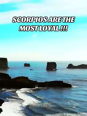 An image featuring a serene ocean scene under a clear, bright sky. The foreground shows dark, rocky formations along the shoreline. The ocean is a calm, blue expanse with several dark rock formations jutting out of the water. Above, the sky transitions from a light blue near the horizon to a deeper shade at the top, with text overlayed in bold white text with a black outline.