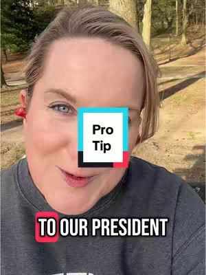 A close-up shot of a woman with fair skin, short blonde hair. The woman is looking at the camera with blue eyes, and pink earbuds are visible in her left ear. A square graphic with the words "Pro Tip" is superimposed over her face. The background is slightly blurred and shows a combination of green grass, a light-brown tree, and other areas covered in brown.