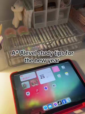 The cover image features a cluttered desk with an iPad in the foreground. The iPad displays app icons. Above the iPad are various items, including pencils, pens, and small decor items.
