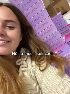 A woman is smiling, with boxes behind her. Text is overlaid on the image.