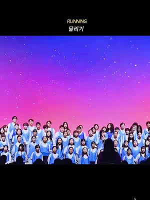The image features a choir of children against a vibrant backdrop with text overlays.