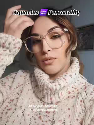 The cover image features a woman wearing glasses and a sweater, with overlaid text indicating the video's focus on Aquarius personality traits. The woman has long, light brown hair and is making a gesture with her hand near her head. The background is blurred, suggesting an indoor setting.