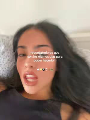 A selfie-style shot featuring a young woman lying down, with a text overlay at the top. The woman has dark hair and is looking slightly to the side with her mouth open. The background appears to be a bed or similar soft surface.