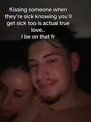 A close-up shot of a couple, focusing on the faces of a man in the foreground and a woman partially visible beside him, with text overlays on their heads.
