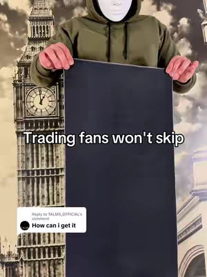A person wearing a mask and hoodie is holding up a black rectangular mousepad. Behind them is a blurred background with imagery of a large clock tower, likely Big Ben.