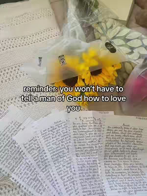 The cover image shows a bouquet of sunflowers in a clear plastic wrapper, with the stems of the flowers partially visible. Behind the flowers, there are more flowers and possibly other items in a soft-focus background, with a white knitted blanket and some handwritten notes. Text is overlaid on the image, and it is set in a bright, well-lit environment.