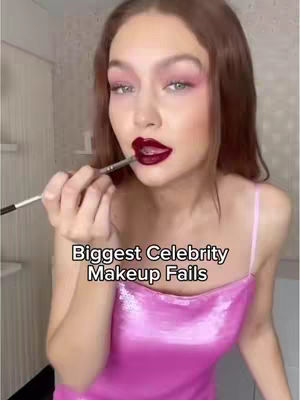 A woman with light skin is shown from the chest up, applying dark lipstick with a brush. The background appears to be a bathroom setting, slightly blurred. The image features text overlayed at the bottom, with a title about makeup fails.