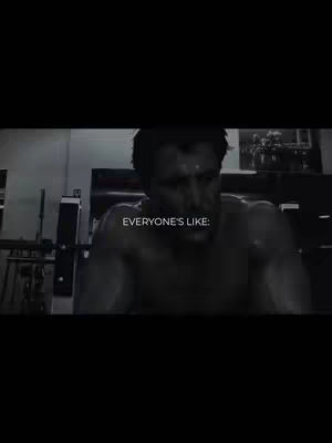 A grayscale image of a man in a gym, shirtless, with a determined expression. Text overlayed says 'EVERYONE'S LIKE:'. The background shows gym equipment and dim lighting.