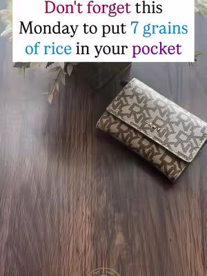 The cover image is a top-down shot with a wooden surface as the background. A printed DKNY wallet lays near the upper-right. The text overlay features a white rectangle with black writing, with the central statement highlighted in bright blue.