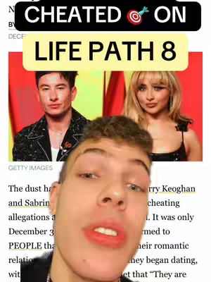 A head-and-shoulders selfie video cover with the creator at the bottom. In the background, it features a screenshot of a tabloid article, with the headline "CHEATED ON" above the words "LIFE PATH 8". The creator in the foreground is looking directly at the camera.