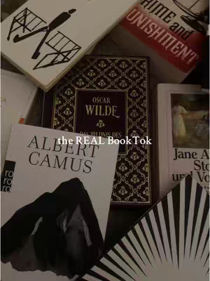 The cover image features an arrangement of books, with their covers visible. At the center, a book with the title 'OSCAR WILDE' dominates, surrounded by titles such as 'CRIME and PUNISHMENT' and 'ALBERT CAMUS.' The layout appears to be an overhead shot of the books casually placed. The background is a warm neutral tone. Text overlays include 'the REAL Book Tok'.