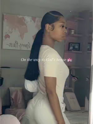 A woman with a black ponytail is shown from the side, wearing a cream-colored top and pants. The image has a light, bright feel, with a soft background that includes a world map and a shelf. The text overlay reads 'On the way to God's house'.