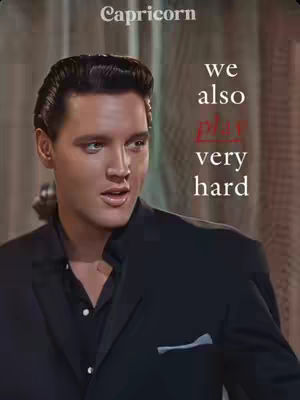 The image presents a stylized portrait of Elvis Presley, primarily in a close-up shot. He's seen from the chest up, looking slightly to the side with a neutral expression. The background is muted, allowing the focus to remain on Presley. Text overlays are present in white and red, conveying a message within the context of astrology, given the context around Capricorns.
