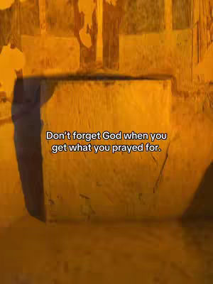 An image showing a stone wall in a vertical frame, bathed in a yellow hue. The lighting suggests a late or early time of day. Text overlays the image in white.