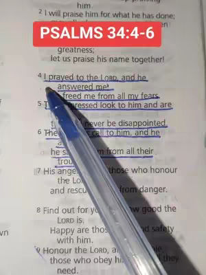 A close-up shot of a Bible page with text highlighted in blue. A pen is positioned diagonally across the page. A red rectangular overlay at the top reads, "PSALMS 34:4-6". The image shows a focus on scriptural verses.