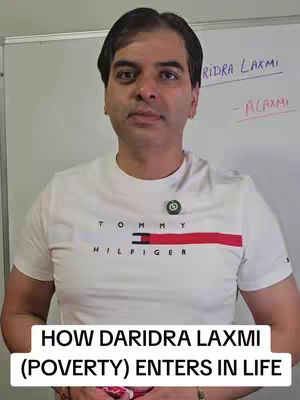 A man in a white t-shirt with a logo stands in front of a white board. There is text overlayed at the bottom of the image.