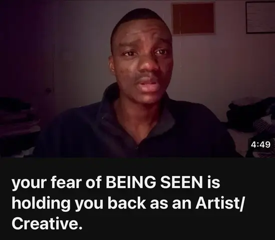 A man with dark skin looks directly at the camera, set against a dimly lit room. The background is blurred, with hints of items like clothing or storage. The title overlayed in the bottom of the video is a text hook.