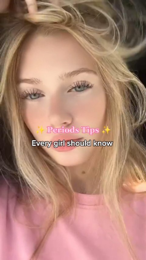 A close-up shot features a fair-skinned woman with long, light blonde hair. The main focus is on her face, with visible eyelashes, and a hint of blush. Text overlays, in a pink and white color scheme, state "'Periods Tips' and 'Every girl should know'."