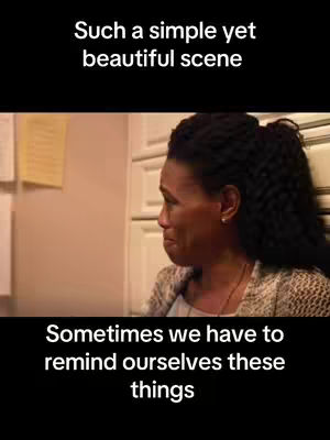 The cover image is of a woman, likely in a room with a beige wall. She is looking down and to the side with a sad expression, which is evident by the tear on her face . The woman has dark hair pulled back. The image is set with text overlays, one at the top and another at the bottom with a black background. At the top it reads 'Such a simple yet beautiful scene' and at the bottom it reads 'Sometimes we have to remind ourselves these things'.