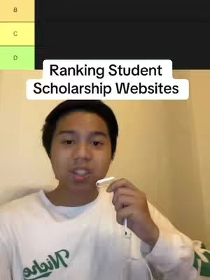 A young man is centered in the frame, holding a white earbud cord while speaking. Above him is a white box with the text 'Ranking Student Scholarship Websites'. Behind him is a tier list with the top bar colored yellow and a part of a bar that shows the letter 'B' in yellow. There is a wall-like color background.