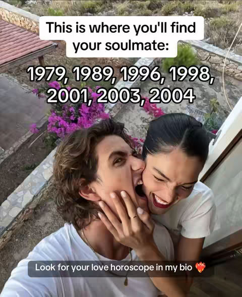 A cover image showing a couple embracing intimately outdoors, with the woman playfully biting the man's cheek. Text overlays suggest the video relates to soulmates and dates.