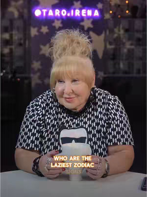 The cover image features a woman with blonde hair, wearing a black and white patterned shirt. The woman is holding a grey item, while text at the bottom of the image reads, "WHO ARE THE LAZIEST ZODIAC SIGNS,"