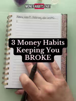 The cover image shows a spiral-bound notebook open on a desk. A person's hand is holding a black pen and resting on the notebook. The top of the notebook has text that says "Money Habits Keeping you broke". Below this is a large, bold, black text overlay "3 Money Habits Keeping You BROKE". The background is a light green. The overall composition is clean, with a focus on the notebook and the message.