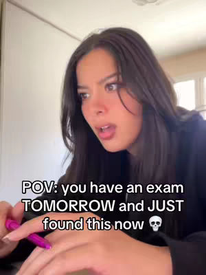 A young woman with long dark hair is shown from the chest up, looking surprised with her mouth slightly open. Text overlayed on the image reads, "POV: you have an exam TOMORROW and JUST found this now." A pink pen is held in her right hand.