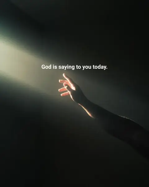 A darkened image with a hand reaching upwards towards a bright light. The hand and arm are silhouetted against the light. In the background, a dark, almost black space creates a sense of mystery and depth. The lighting suggests a beam of light shining down, probably from above.