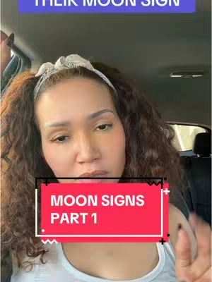 A woman with curly brown hair is in a car, with text boxes overlaid on the image. One says 'Moon Signs PART 1' and the other says 'THEIR MOON SIGN'.