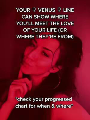 A selfie-style image with a woman in a low-lit, red-toned setting. She is looking towards the camera with a partially obscured hand near her face, and text overlays describe astrological interpretations about love.