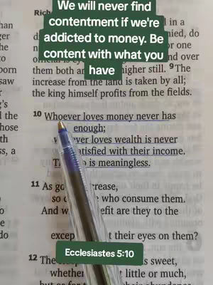 A picture of a book, with the text from Ecclesiastes 5:10 highlighted with a pen, and a hook added on top.