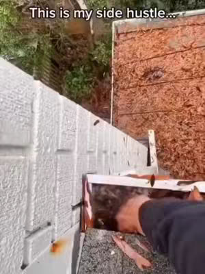The cover image shows a first-person perspective of a person working on a building's gutter system. The focus is on the person's hand as they interact with the gutter, with tools and building materials in view. The lighting appears natural, possibly outdoors. The color palette is muted, with browns, grays, and hints of green from the surrounding foliage. The composition is straightforward, emphasizing the task at hand.