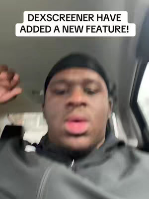 The cover image shows a close-up of a man in a car. Text overlay reads "DEXSCREENER HAVE ADDED A NEW FEATURE!".