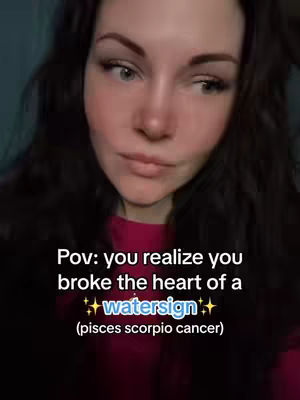 The image shows a close-up of a woman's face with dark hair and a thoughtful expression. Text overlays are added, with the main text asking, "Pov: you realize you broke the heart of a watersign (pisces scorpio cancer)." She has a slightly furrowed brow and is looking off to the side. The background appears dark, and she's wearing a pink shirt.