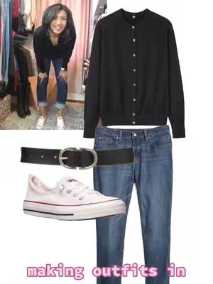 A woman stands in front of a wardrobe with a collage of clothing items composed over her. The outfit includes a black cardigan, blue jeans, a belt, and white sneakers. The background is light pink with clothes in the closet.
