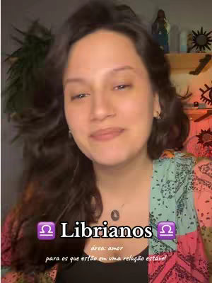 The cover image features a woman with long, wavy brown hair, facing the camera with a slight smile. She is wearing a patterned top with shades of green and pink. The background is somewhat indistinct, with hints of a room setting. Text overlays include the word "Librianos" and other details.