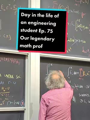 The image shows a person writing on a chalkboard. The person is seen from the back, with a pink shirt and white hair. The person is standing in front of large chalk boards with math equations on them. A colored rectangle with white text is overlaid on the image.