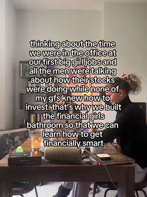 A woman is sitting at a table in an office type setting. Text overlay is written on top of the image.