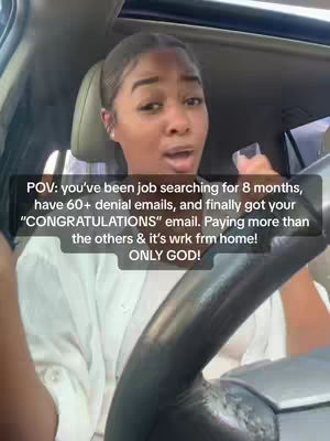 A woman is sitting in the driver's seat of a car, looking directly at the camera and speaking. The background shows a daytime setting with other cars and buildings visible through the windows. Overlay text provides context about the video's message.