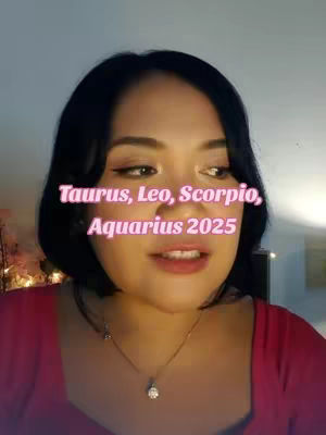 A woman with dark hair and a red top is centered in the frame, with the text overlay of Zodiac signs and "2025" in a pink font. The background is a softly lit, interior space.