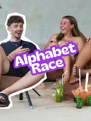 A cover image shows two young people, a man and a woman, smiling while sitting next to each other. The man on the left is holding a phone. The woman is laughing. The text overlay 'Alphabet Race' in white font with a purple border is in the middle of the image.