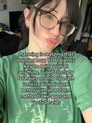 A selfie of a person with dark hair and glasses, looking at the camera with a slight smile. Text is overlaid on the image.