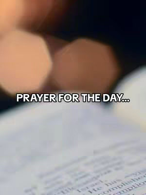 The cover image features a close-up shot of an open book with blurry, golden-toned background lights. The text overlay that reads "PRAYER FOR THE DAY..." is positioned in the top center of the image.